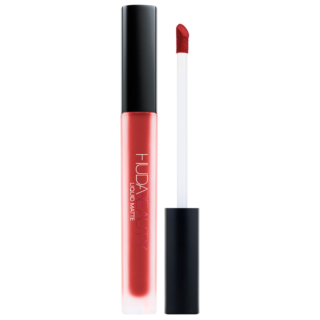 Lipstick with black cap and red shade on a white background