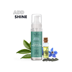 Shea Moisture hair care products with leaves and flowers on a white background